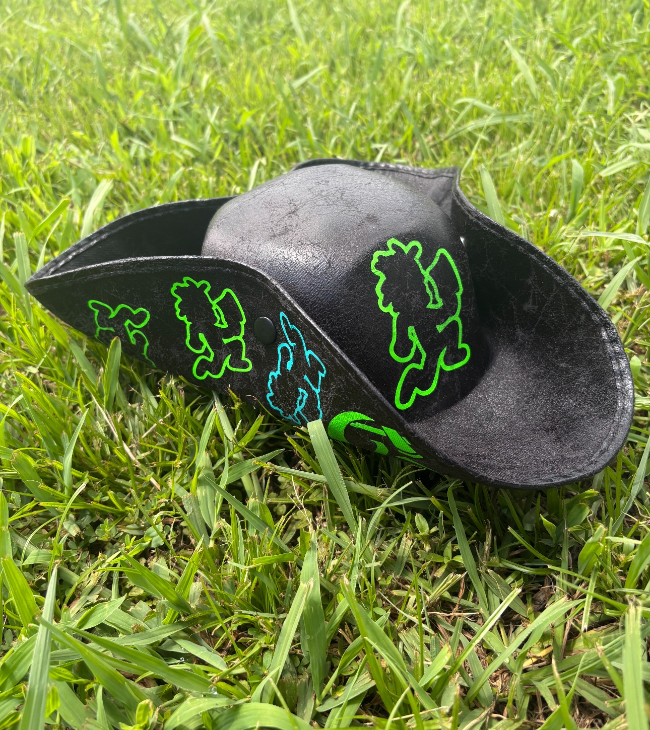Black custom hat decorated with neon Voodoo Vinyl graphics