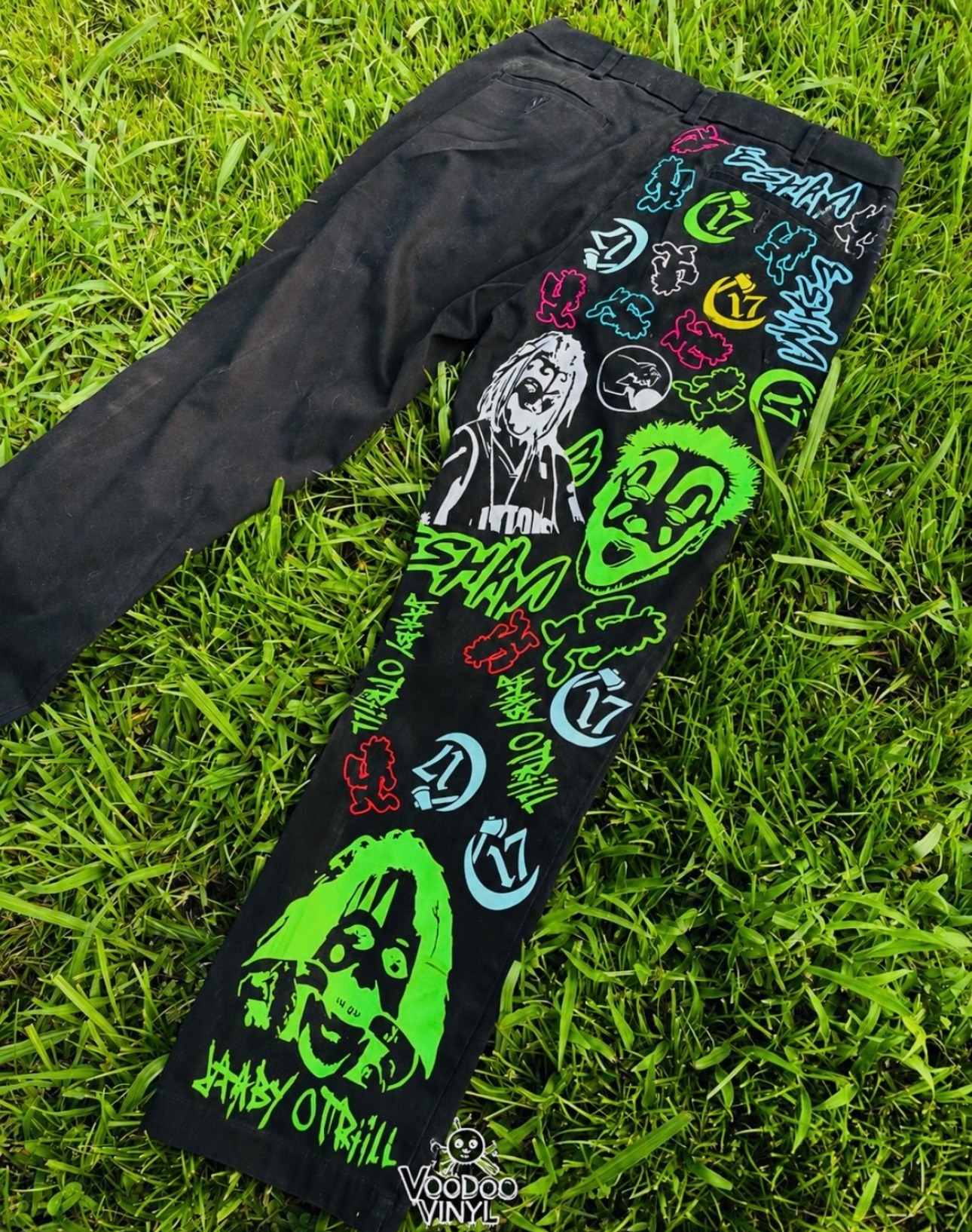 Black pants covered with colorful Voodoo Vinyl street-art graphics