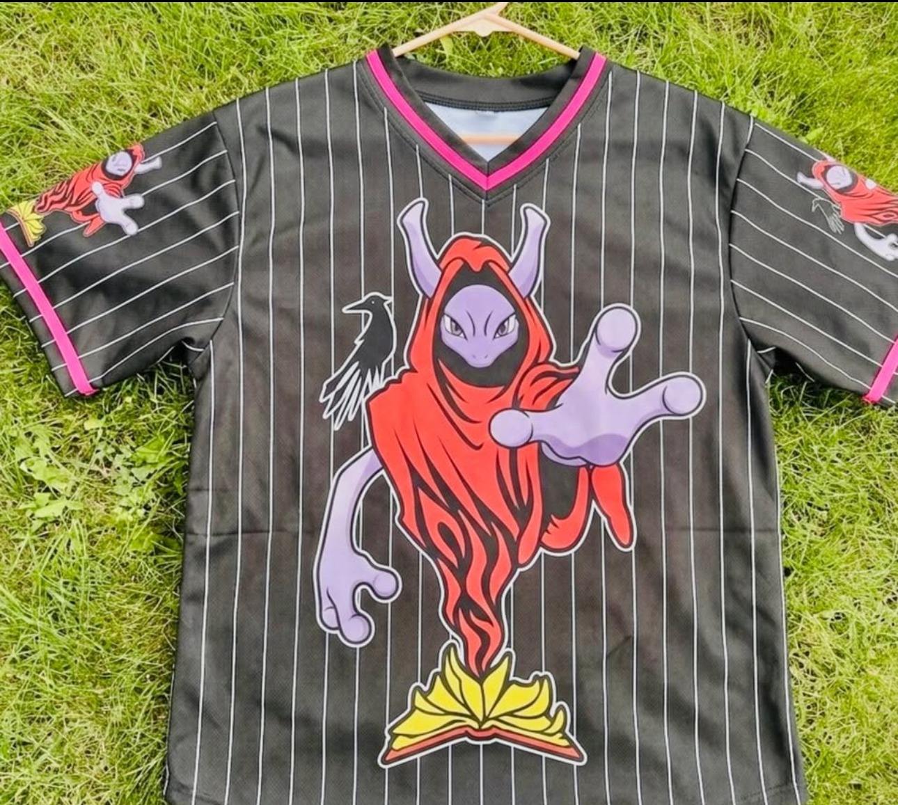 Black Voodoo Vinyl baseball jersey featuring a hooded purple character with a raven